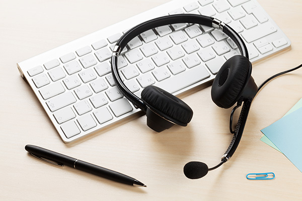 Headphones and keyboard on desk